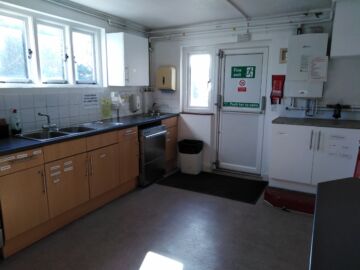 Full kitchen off of the main hall