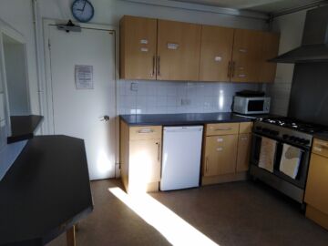 Full kitchen off of the main hall